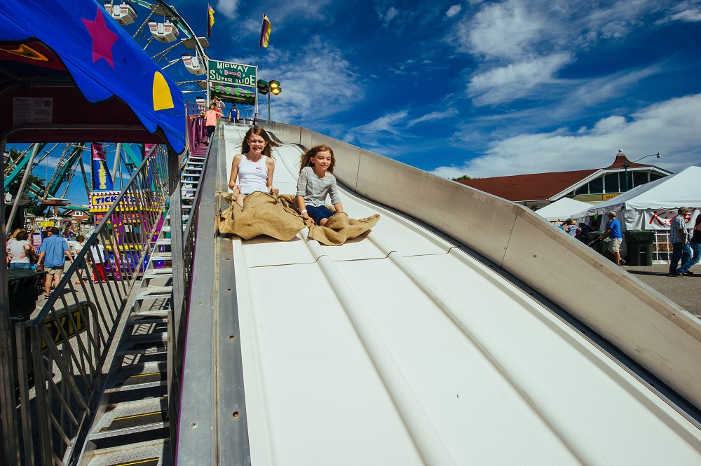 kids on a fair slide